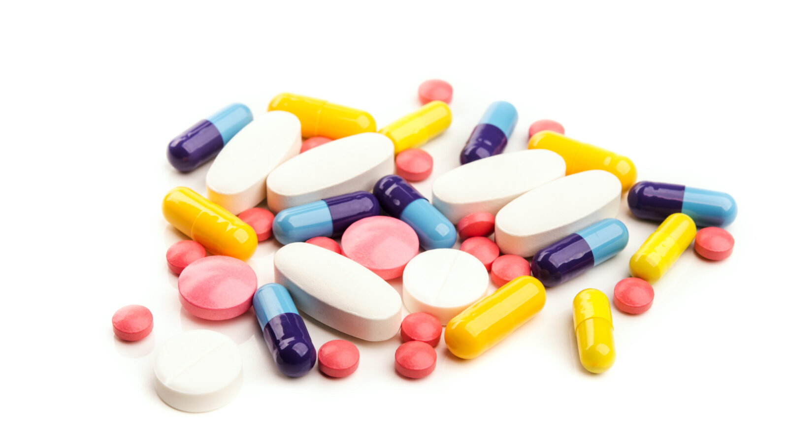 pile of colorful pills isolated pile of colorful pills isolated on white background