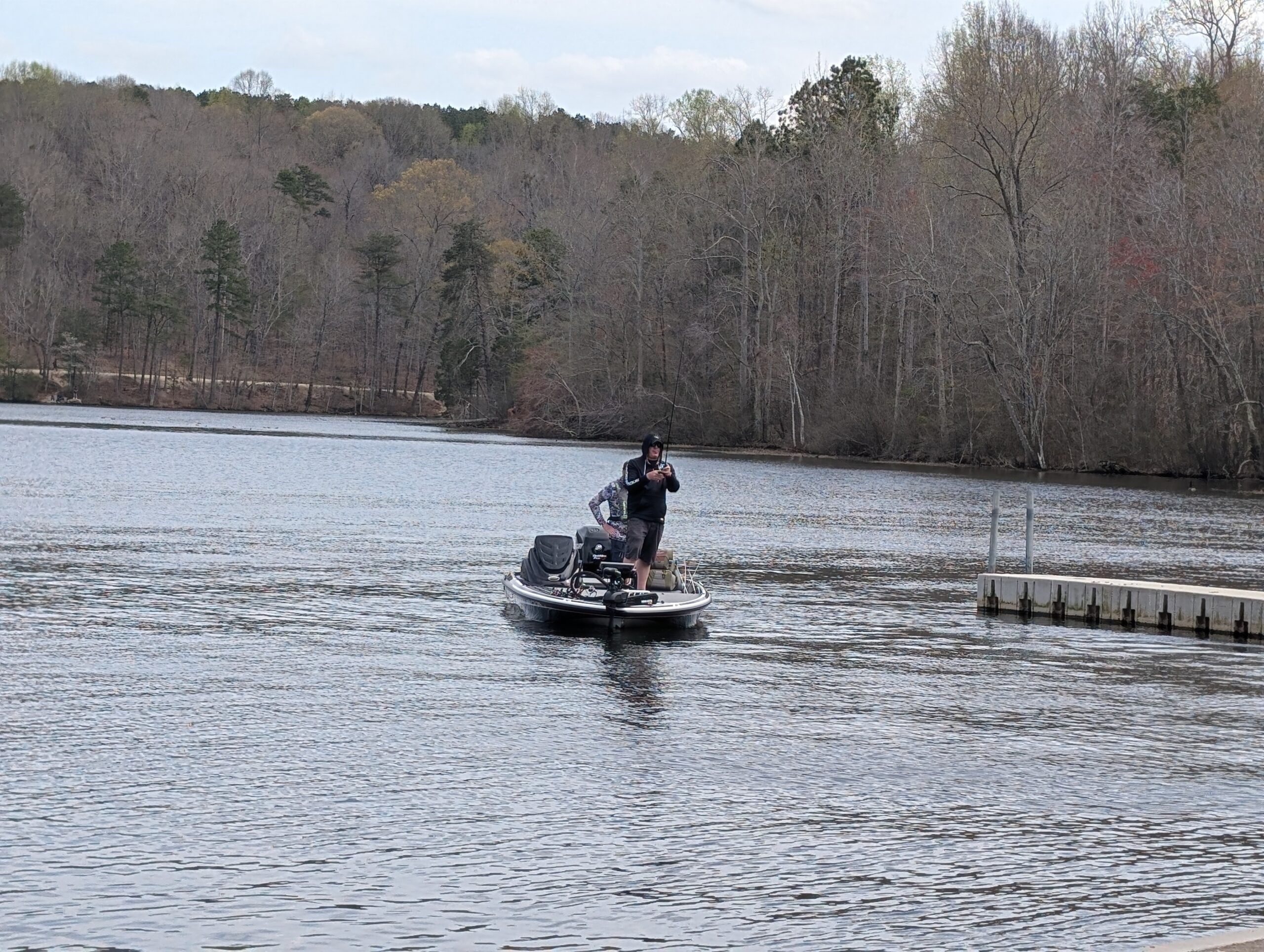 Two people on a boat in Salem Lake while fishing